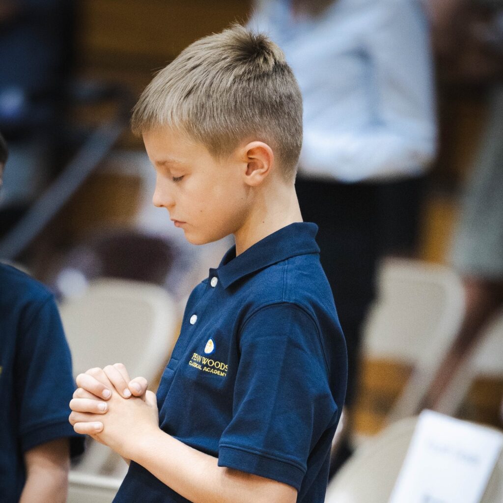 Penn Woods Classical Academy student in prayer. South Hills, Pittsburgh, PA